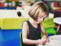 kid at desk